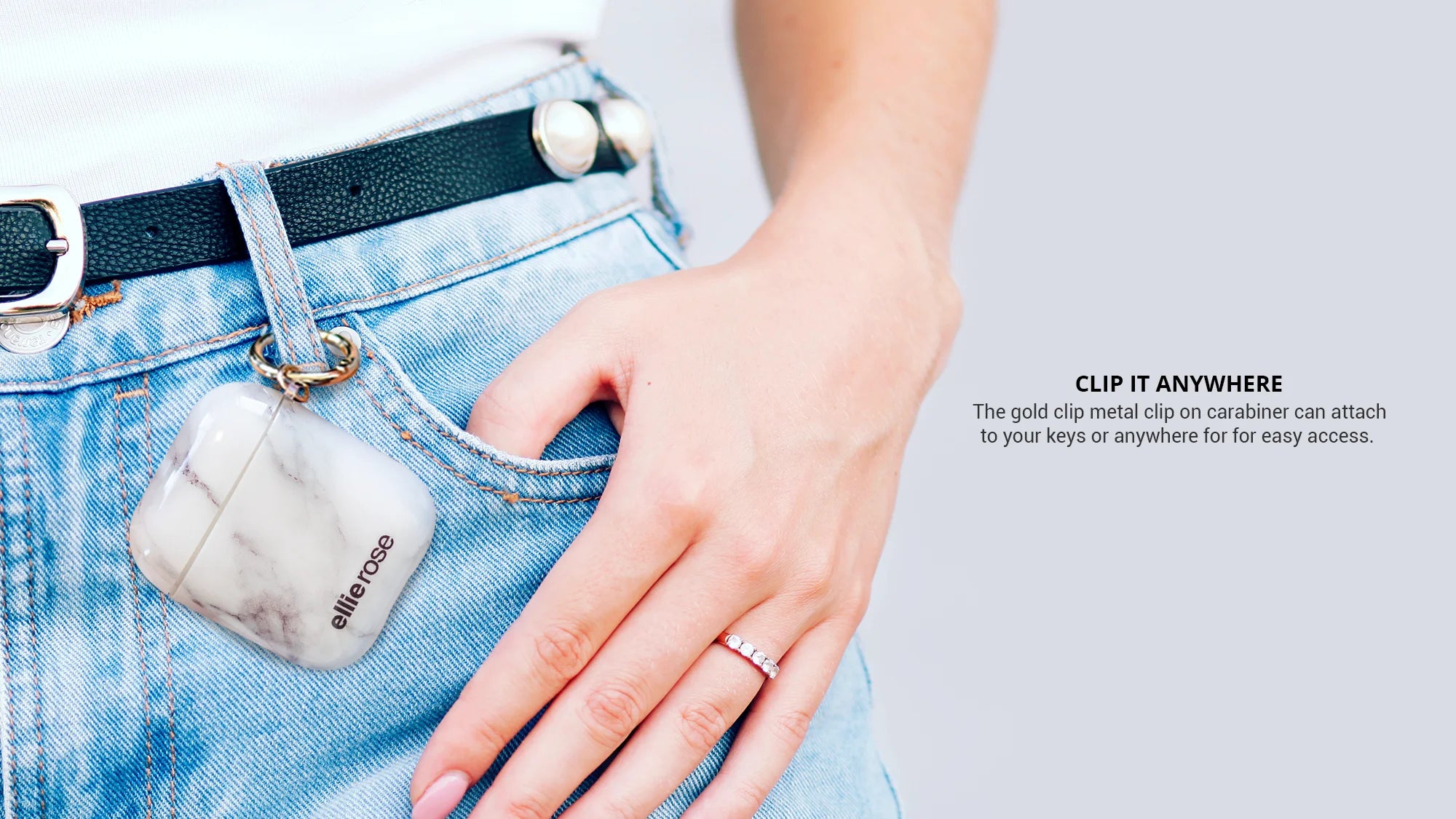 White marble airpods case clip with gold ring on blue jeans