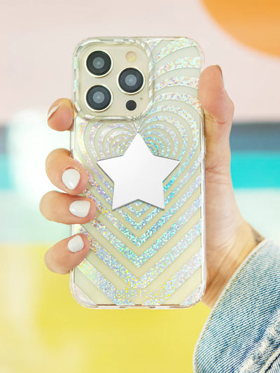 Star stick on mirror phone decals while holding a Endless love iPhone case