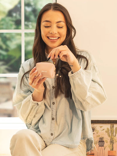 Using a Blush Ellie rose pouch with painting on the background