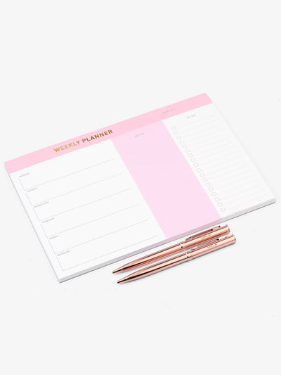 Weekly planner side view with 2 rose gold pens