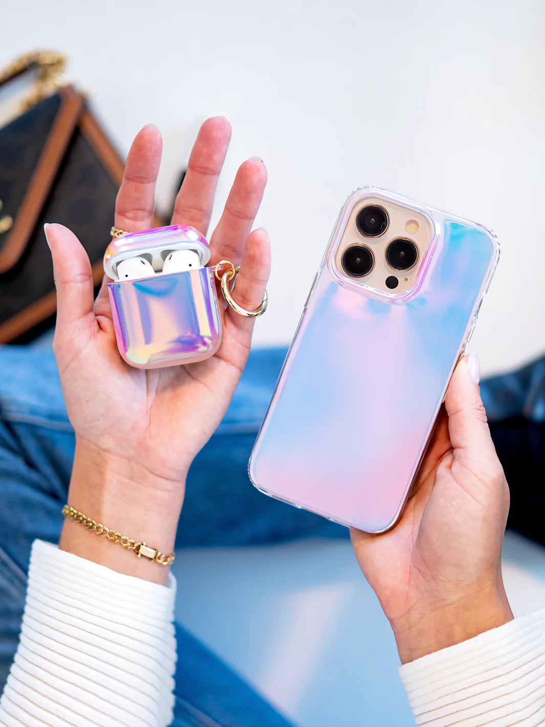 Aura Airpods Case and iPhone aura case on palm