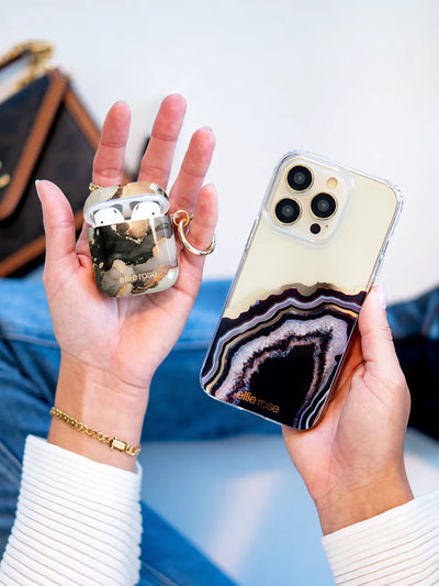 Mercury Marble AirPods Case  held in hand with iphone