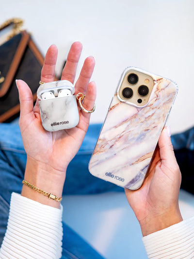 White marble airpods case together with iphone case on hand