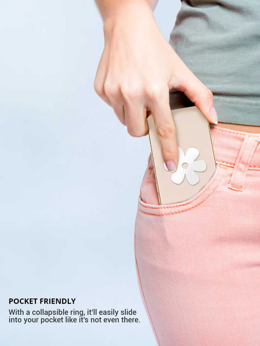 Putting an iphone on a pocket showing stick on phone flower decal wearing pink jeans