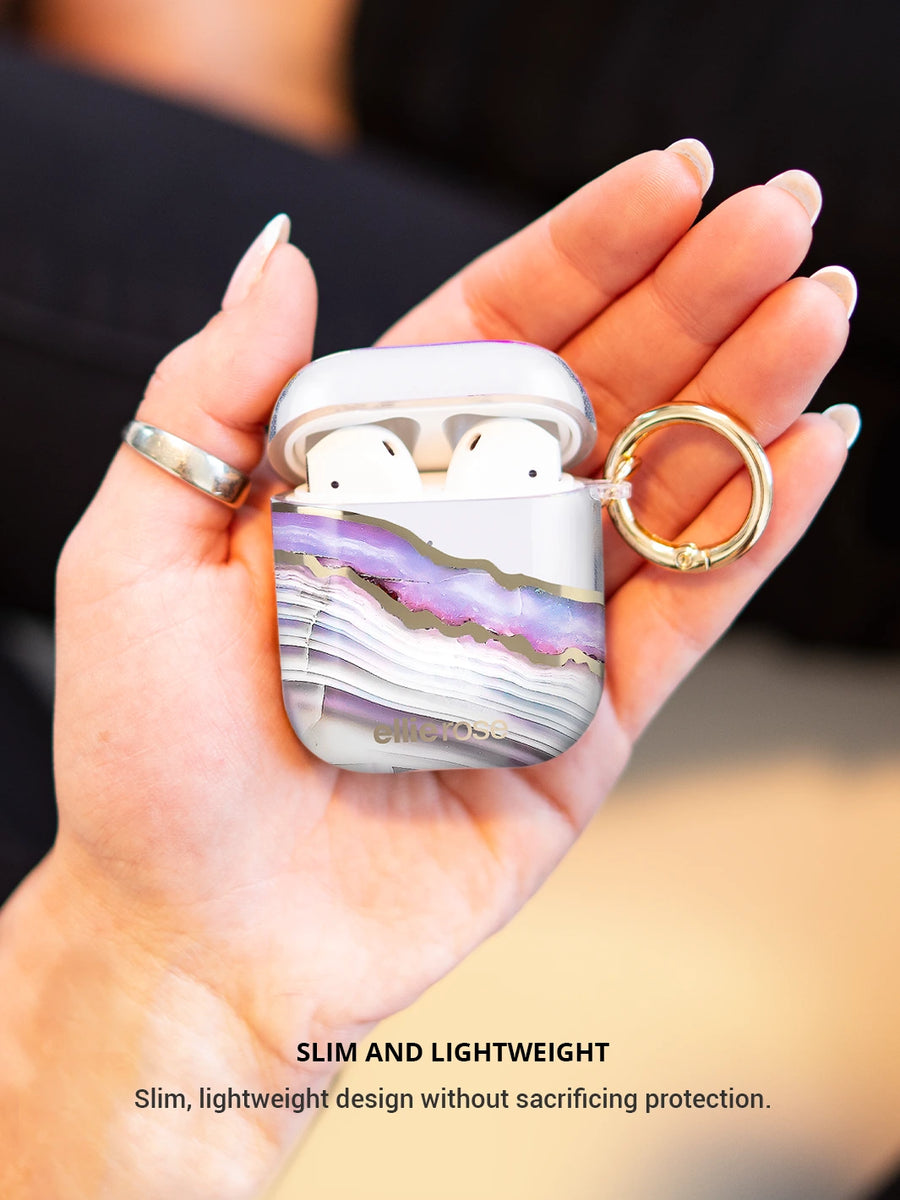 Showing lavender agate airpods case on hand with gold ring