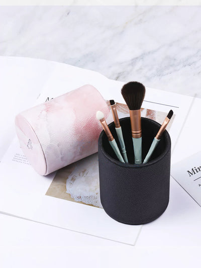 Black Faux leather pen cups with makeup brush a white wedding paper