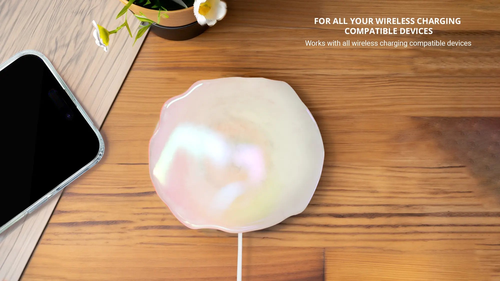 Showing Quartz holographic wireless charger with iphone and flowers