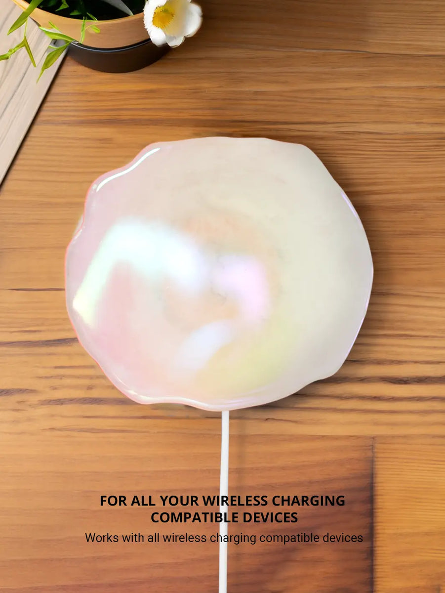 Showing Quartz holographic wireless charger with iphone and flowers