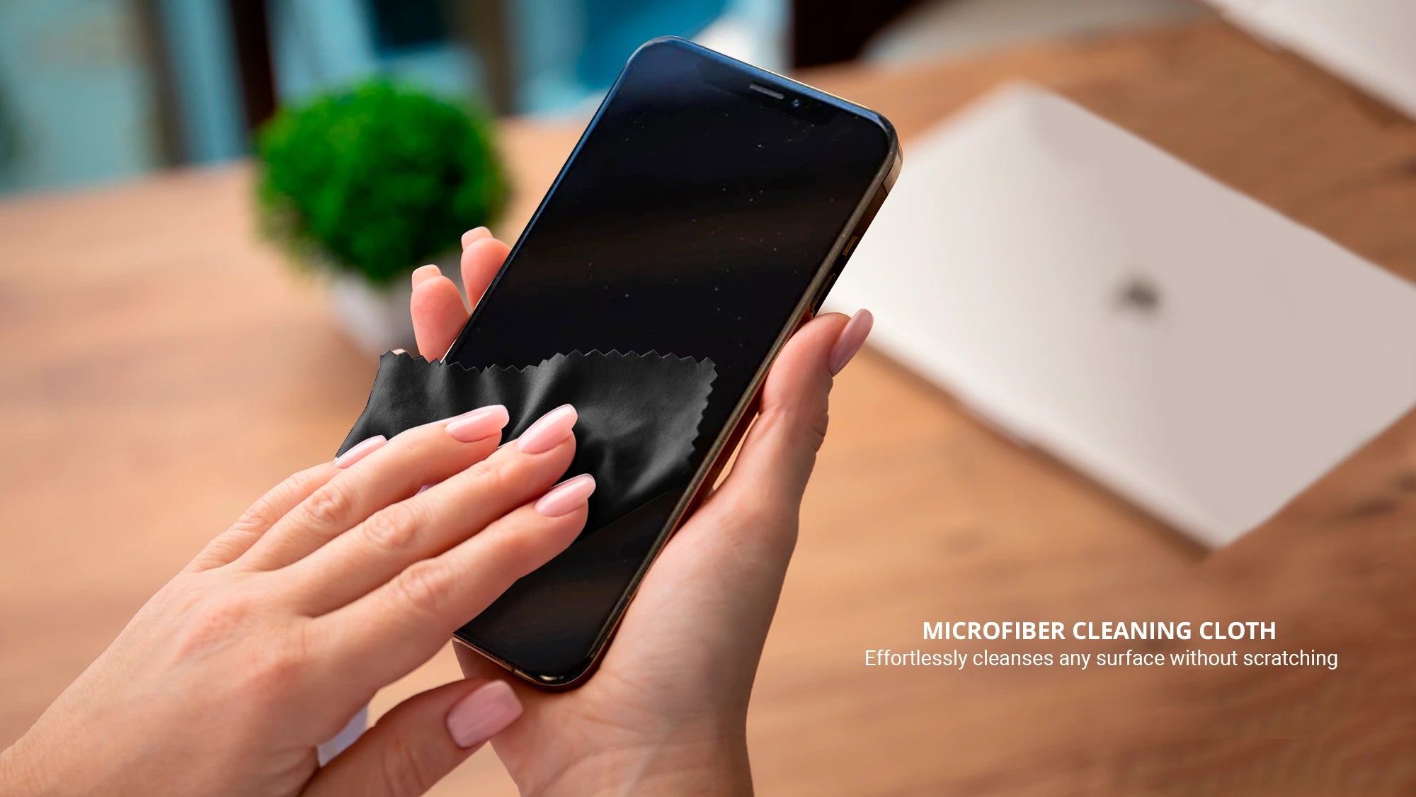 Cleaning an iphone using black microfiber cloth from tech kit