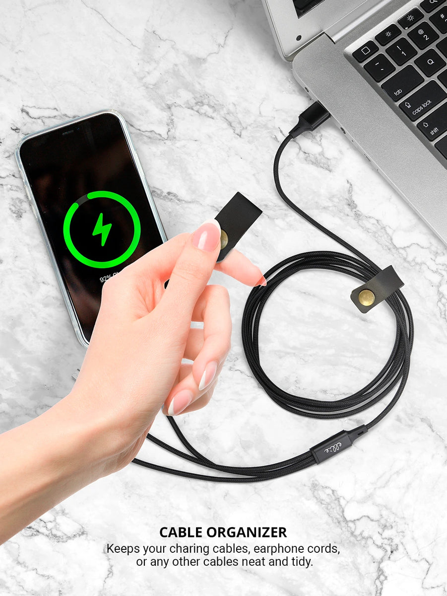 using black cable organizer while charging an iphone and laptop