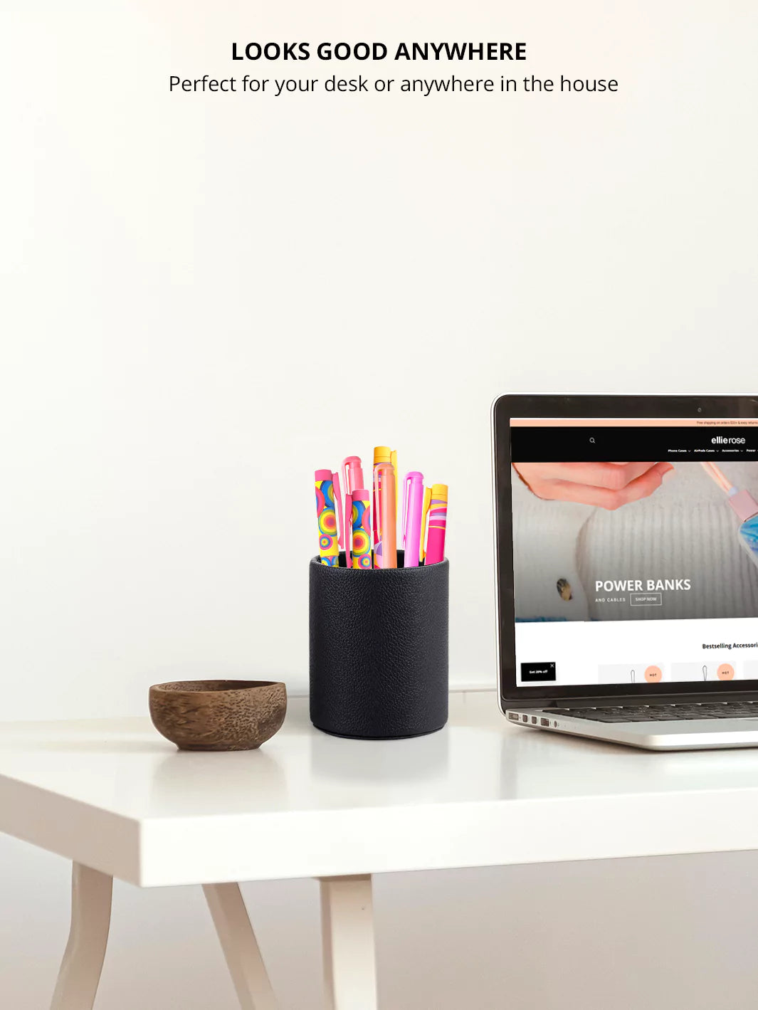 Black Faux leather pen cup with colorful pens and a laptop