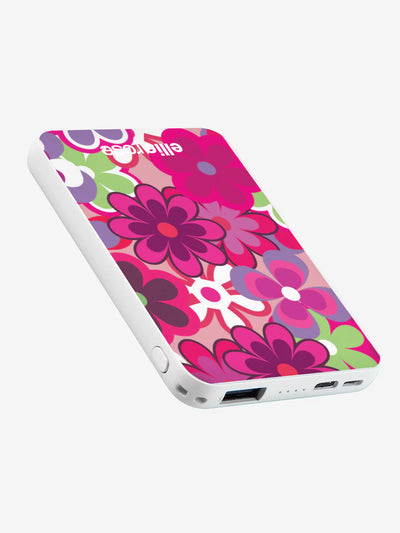 Groovy Floral powerbank while on pocket with black charging cable