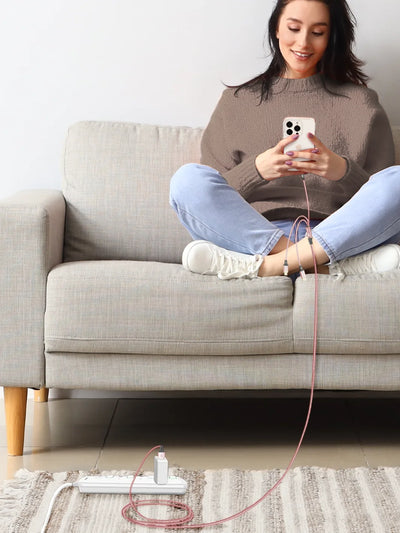 Charging an iphone while seating on sofa using Rose gold 3 in 1 charging cable