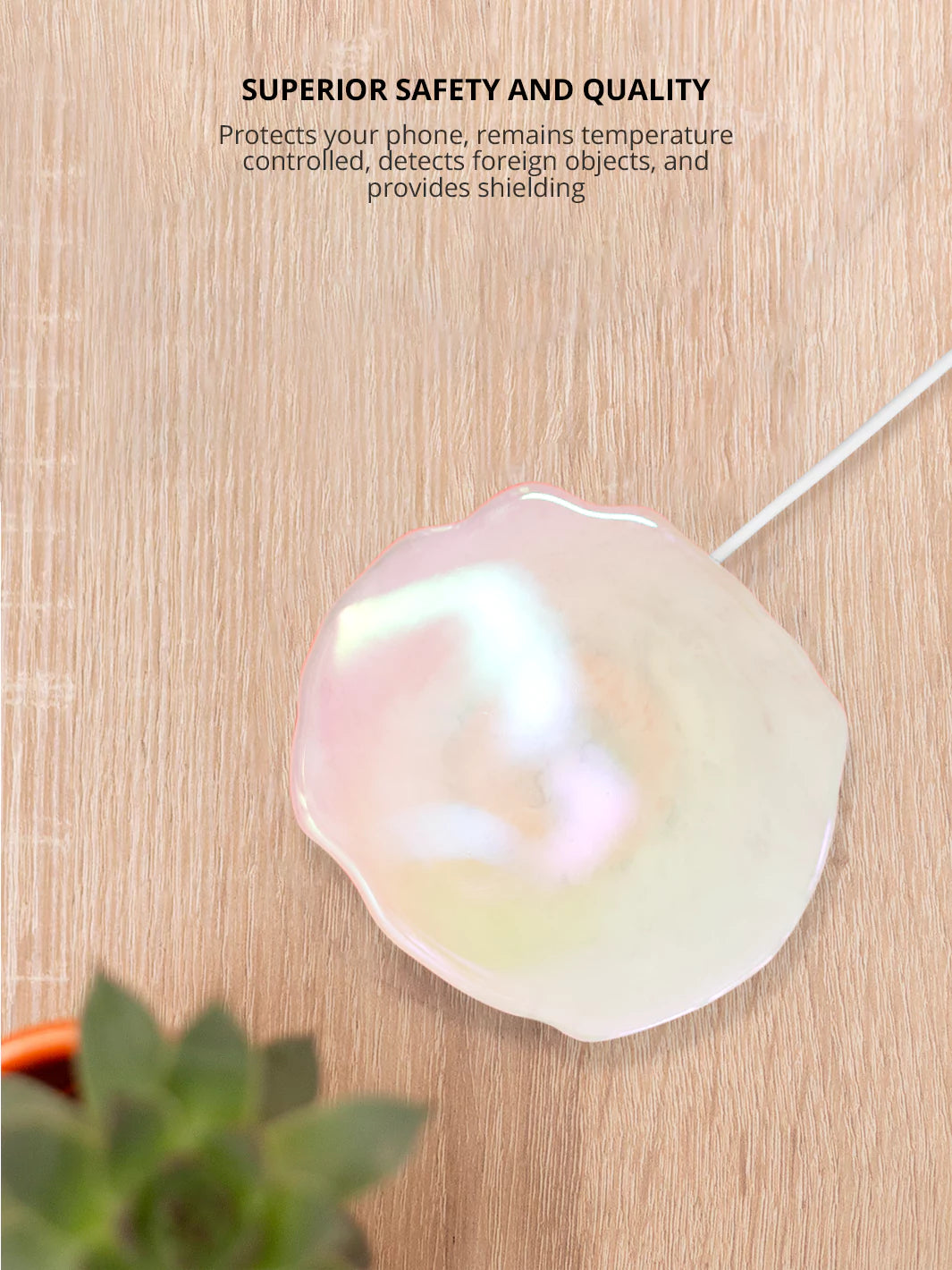 Quartz Holographic Wireless Charger  with plants on a brown background