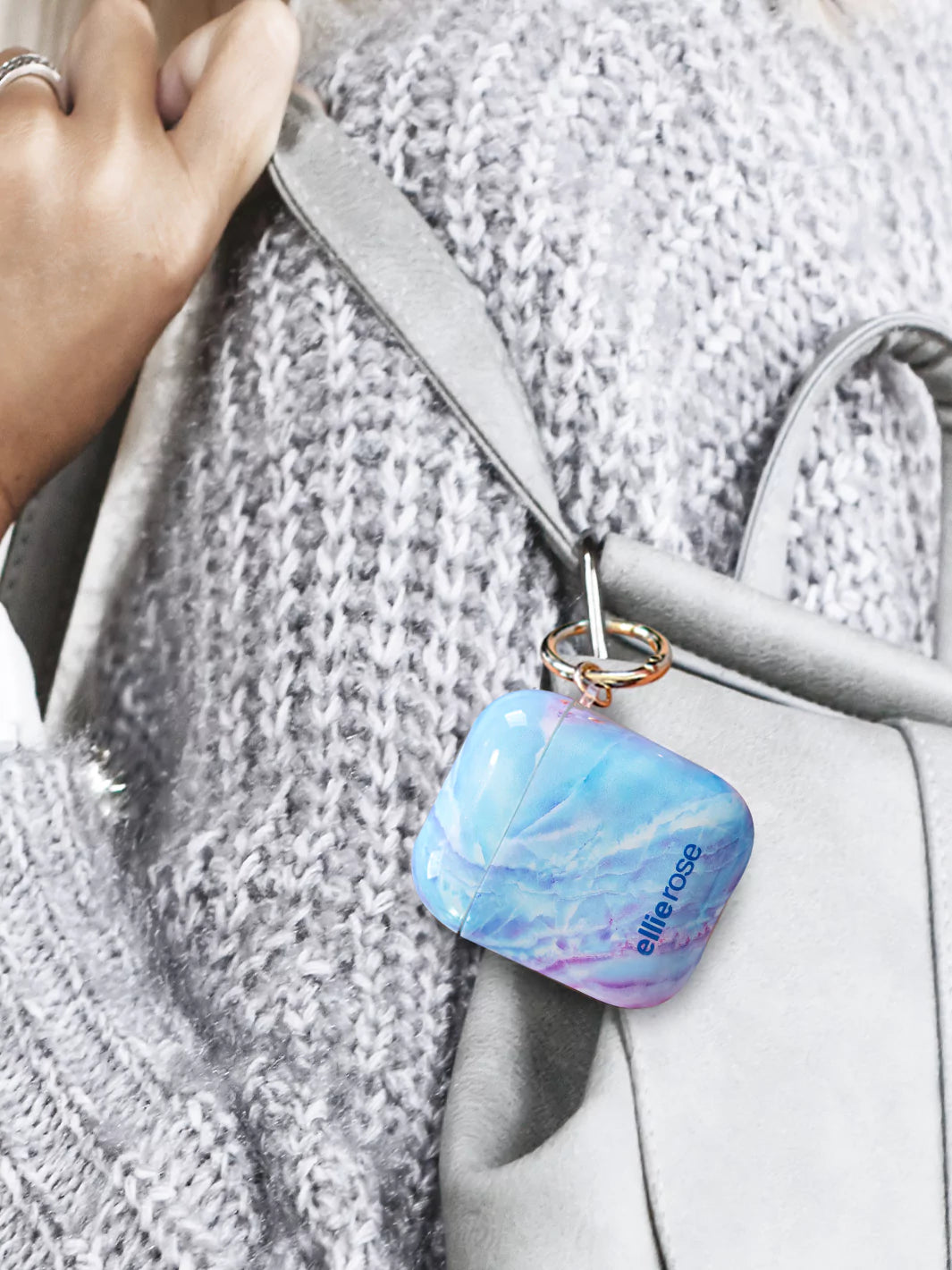 Mystic Journey AirPods Case attached to siiver body bag