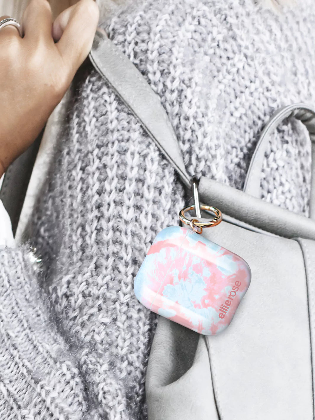 Pink and Blue tie Dye AirPods Case attached to silver body bag