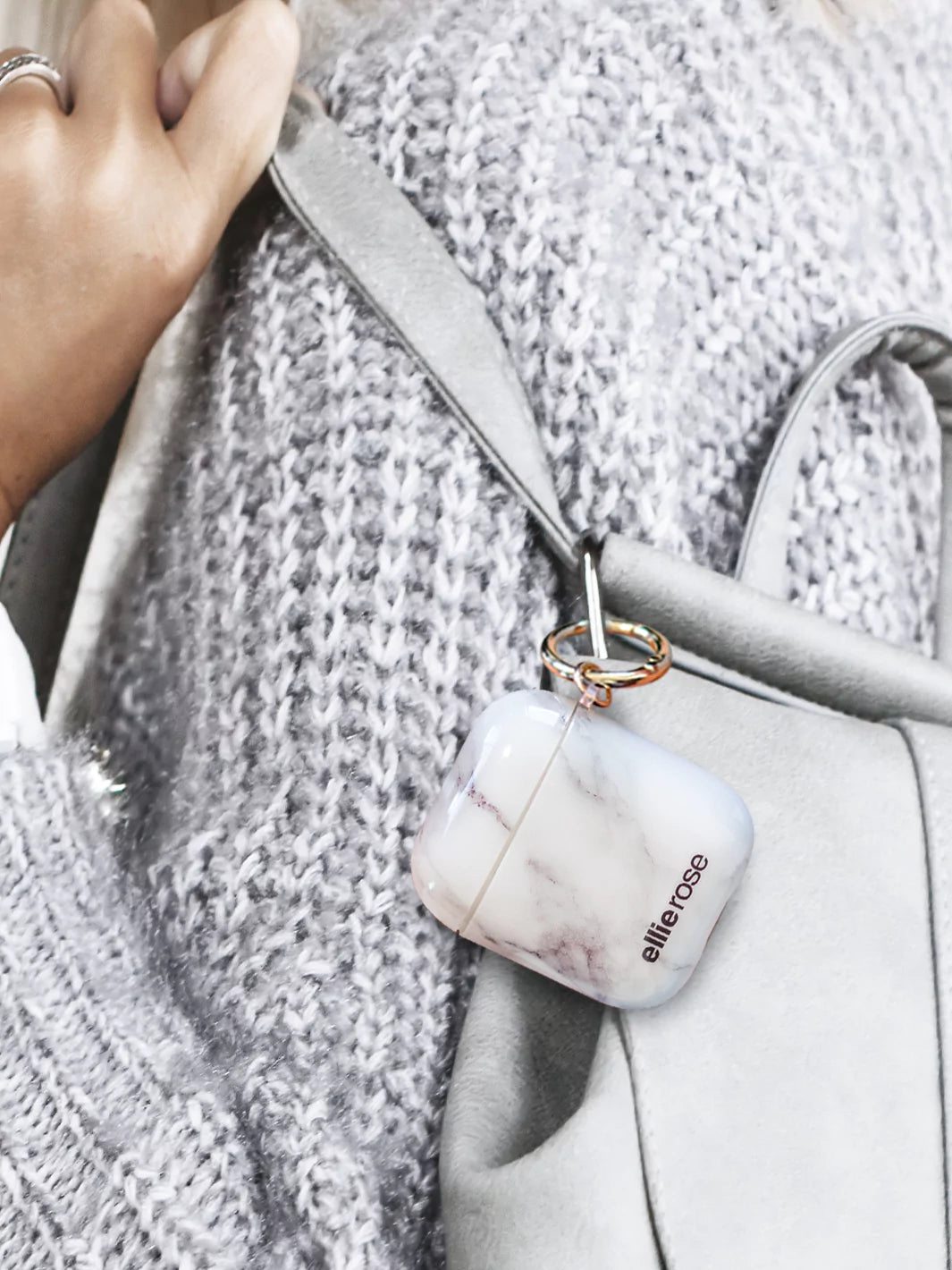 White Marble AirPods Case attached to silver body bag